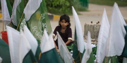 A Pakistani girl vendor sells Pakistani flags to celebrate the 68th Independence Day, in Rawalpindi, Pakistan, Wednesday, Aug. 13, 2014. Pakistan will commemorate its Independence in 1947 from British colonial rule, on Thursday. (AP Photo/B.K. Bangash)
